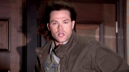 Sam's hair is blown back as he watches Dean. Sam's hair is blown back as he watches Dean.